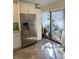 Stainless steel refrigerator and white cabinetry highlight this kitchen at 4615 Hidden View Pl # 26, Sarasota, FL 34235