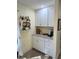 White cabinets and granite countertops in this well-equipped kitchen at 4615 Hidden View Pl # 26, Sarasota, FL 34235
