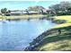 Scenic view of a lake with a duck and houses at 4615 Hidden View Pl # 26, Sarasota, FL 34235