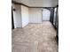 Spacious screened patio featuring paver tile floor and extra storage at 4615 Hidden View Pl # 26, Sarasota, FL 34235