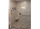 Walk-in shower with built-in seat and grab bars at 4615 Hidden View Pl # 26, Sarasota, FL 34235