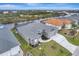 Aerial view of a waterfront house with a gray roof at 10442 Winnipeg St, Port Charlotte, FL 33981
