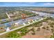 Aerial view of a canal-front house in a residential area at 10442 Winnipeg St, Port Charlotte, FL 33981