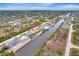 Aerial view of a waterfront property with a canal view at 10442 Winnipeg St, Port Charlotte, FL 33981