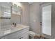 Modern bathroom with white vanity and frosted glass door at 10442 Winnipeg St, Port Charlotte, FL 33981