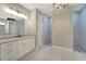 Spa-like bathroom with a large walk-in shower and marble vanity at 10442 Winnipeg St, Port Charlotte, FL 33981