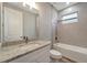 Updated bathroom with granite countertop and bathtub at 10442 Winnipeg St, Port Charlotte, FL 33981