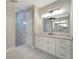 Elegant bathroom with double vanity, marble shower, and modern fixtures at 10442 Winnipeg St, Port Charlotte, FL 33981