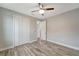 Well-lit bedroom with wood-look floors and large closet at 10442 Winnipeg St, Port Charlotte, FL 33981