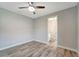 Spacious bedroom with wood-look floors and ensuite bathroom at 10442 Winnipeg St, Port Charlotte, FL 33981