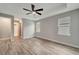 Bright and airy bedroom with ceiling fan and access to the bathroom at 10442 Winnipeg St, Port Charlotte, FL 33981