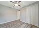 Spacious bedroom with wood-look floors and ceiling fan at 10442 Winnipeg St, Port Charlotte, FL 33981