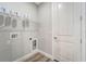 Laundry room with shelving and built-in pet door at 10442 Winnipeg St, Port Charlotte, FL 33981
