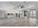 Open concept living room with kitchen and entryway views at 10442 Winnipeg St, Port Charlotte, FL 33981