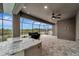 Covered patio with outdoor kitchen and pool access at 10442 Winnipeg St, Port Charlotte, FL 33981