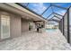 Lush patio with an outdoor kitchen and pool view at 10442 Winnipeg St, Port Charlotte, FL 33981