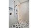 Spa-like shower with marble walls and patterned floor at 10442 Winnipeg St, Port Charlotte, FL 33981