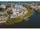 Aerial view of waterfront home with private pool and dock at 114 Gull Dr, Anna Maria, FL 34216