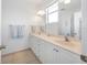 Clean bathroom with double vanity and tile flooring at 114 Gull Dr, Anna Maria, FL 34216