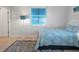 Guest bedroom with full-size bed and blue bedding at 114 Gull Dr, Anna Maria, FL 34216