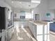 Modern white kitchen with stainless steel appliances at 114 Gull Dr, Anna Maria, FL 34216