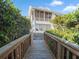 Wooden bridge leading to a home's backyard at 114 Gull Dr, Anna Maria, FL 34216