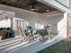 Covered patio with table and chairs, perfect for outdoor dining at 114 Gull Dr, Anna Maria, FL 34216