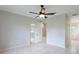 Spacious bedroom with tile floors and access to bathroom at 11662 Old Cypress Cv, Parrish, FL 34219