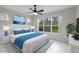Spacious bedroom with ceiling fan and large window at 11662 Old Cypress Cv, Parrish, FL 34219