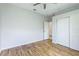 Spacious bedroom with wood floors and ample closet space at 11662 Old Cypress Cv, Parrish, FL 34219