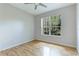 Bright bedroom with hardwood floors and large window at 11662 Old Cypress Cv, Parrish, FL 34219