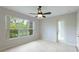 Bright bonus room with tile floors and large window at 11662 Old Cypress Cv, Parrish, FL 34219