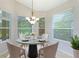 Breakfast nook with a round table and chairs at 11662 Old Cypress Cv, Parrish, FL 34219