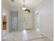 Bright and airy foyer with tile flooring and high ceilings at 11662 Old Cypress Cv, Parrish, FL 34219