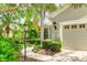 Landscaped walkway leading to a house entrance at 11662 Old Cypress Cv, Parrish, FL 34219
