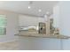 Kitchen boasts granite countertops and stainless steel appliances at 11662 Old Cypress Cv, Parrish, FL 34219