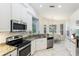 Eat-in kitchen with breakfast nook and island at 11662 Old Cypress Cv, Parrish, FL 34219