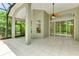 This screened porch is perfect for relaxing at 11662 Old Cypress Cv, Parrish, FL 34219
