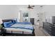 Spacious bedroom with ceiling fan and access to a private patio at 11813 Holly Hock Dr, Lakewood Ranch, FL 34202