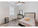 Bedroom with Eiffel Tower bedding and a rocking chair at 11813 Holly Hock Dr, Lakewood Ranch, FL 34202