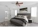 Main bedroom with gray accents and a ceiling fan at 11813 Holly Hock Dr, Lakewood Ranch, FL 34202