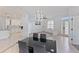Dining area with modern lighting and seating for four at 11813 Holly Hock Dr, Lakewood Ranch, FL 34202