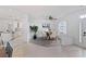 Casual dining area with wood-look flooring and modern table at 11813 Holly Hock Dr, Lakewood Ranch, FL 34202