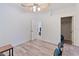 Bright home office with wood-look floors and closet at 11813 Holly Hock Dr, Lakewood Ranch, FL 34202