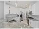 Modern kitchen with white cabinets and granite countertops at 11813 Holly Hock Dr, Lakewood Ranch, FL 34202
