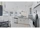 Bright kitchen with an island, stainless steel appliances, and granite countertops at 11813 Holly Hock Dr, Lakewood Ranch, FL 34202