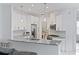 Modern kitchen with white cabinets, granite counters, and stainless steel appliances at 11813 Holly Hock Dr, Lakewood Ranch, FL 34202
