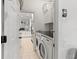 Laundry room with washer, dryer, and kitchen view at 11813 Holly Hock Dr, Lakewood Ranch, FL 34202
