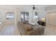 Relaxing living area with gray sectional and access to backyard at 11813 Holly Hock Dr, Lakewood Ranch, FL 34202