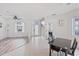 Open concept living room and dining area with wood-look floors at 11813 Holly Hock Dr, Lakewood Ranch, FL 34202